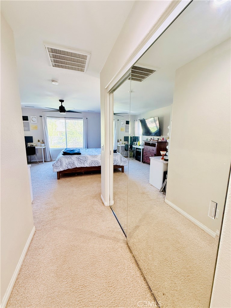 1652 Apollo Way Beaumont, CA 92223 - Photo 14 of 25 a living room with furniture and a flat screen tv