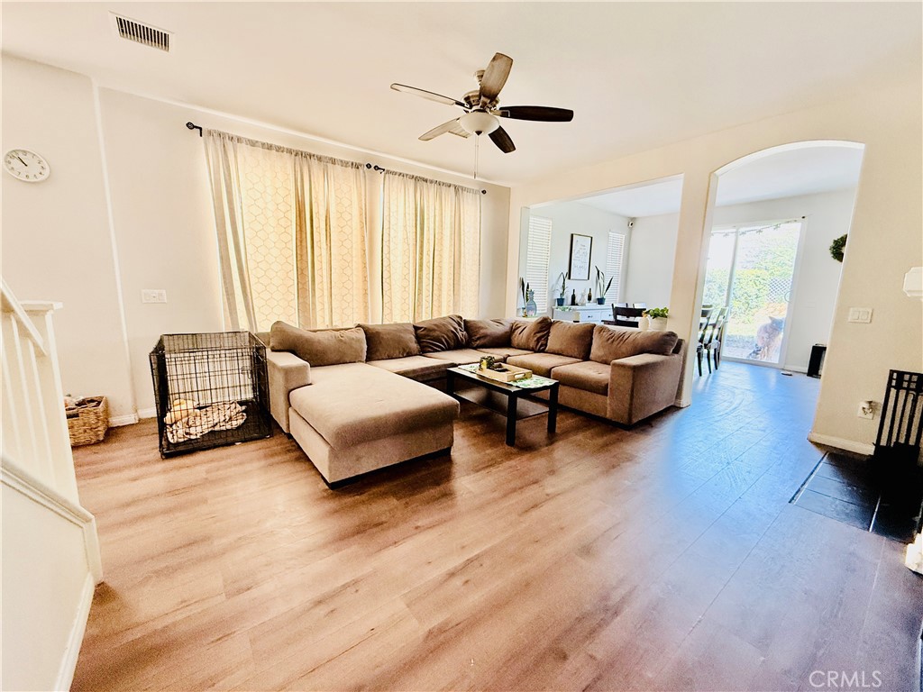 1652 Apollo Way Beaumont, CA 92223 - Photo 2 of 25 a living room with furniture and a large window