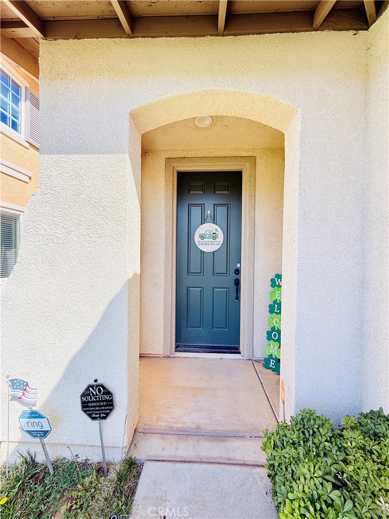 1652 Apollo Way Beaumont, CA 92223 - Photo 23 of 25 a front view of a house with a yard