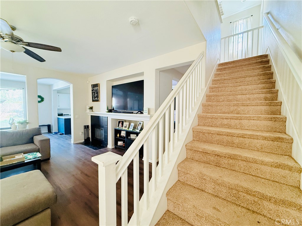 1652 Apollo Way Beaumont, CA 92223 - Photo 10 of 25 a living room with furniture and a fireplace