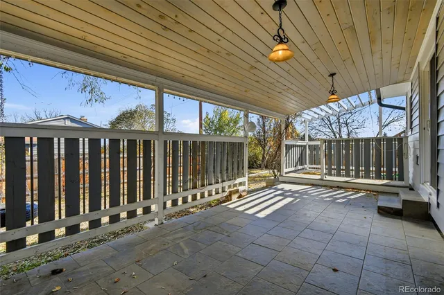 a view of a porch with wooden floor