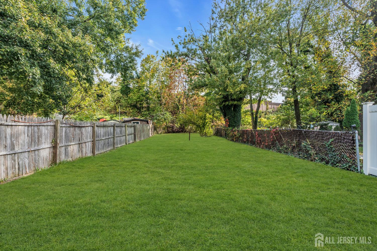 52 MacArthur Drive Edison, NJ 08837 - Photo 32 of 37 a view of a yard with a tree