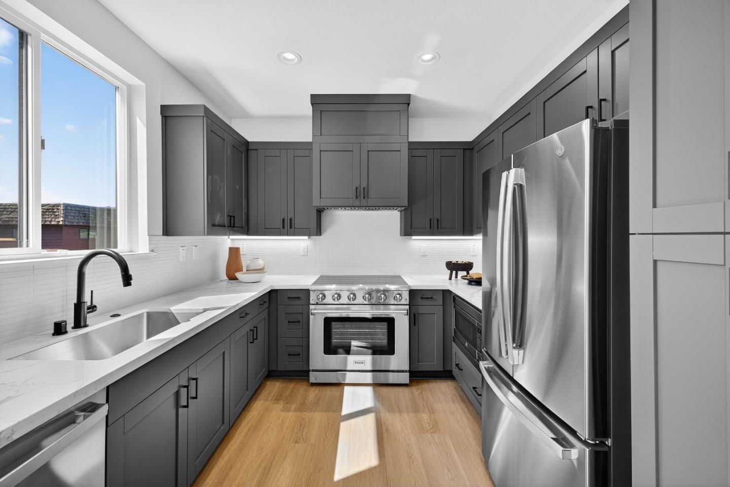955 Woodside Road Redwood City, CA 94061 - Photo 23 of 46 a kitchen with a refrigerator sink and stove