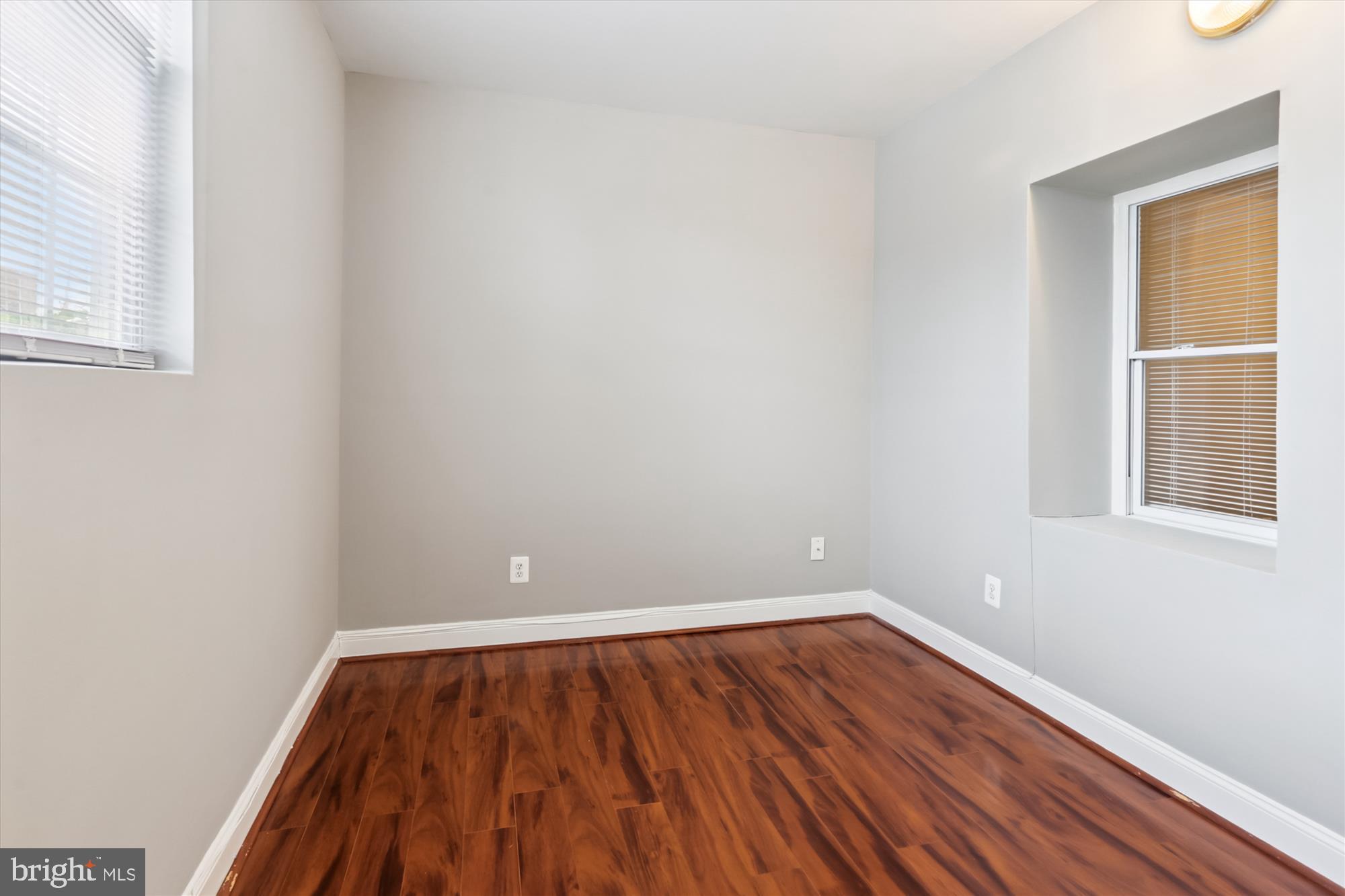 1712 West Virginia Avenue Northeast, Unit 1 Washington, DC 20002 - Photo 11 of 15 a view of an empty room with wooden floor and a window