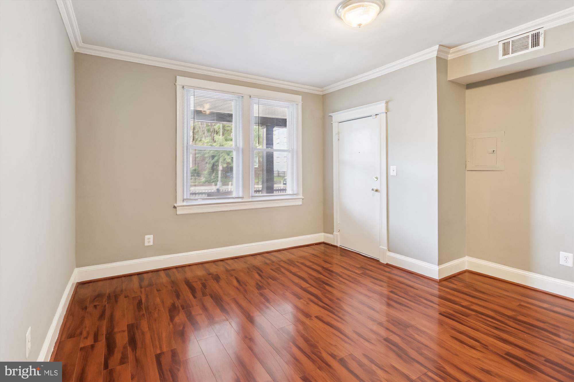 1712 West Virginia Avenue Northeast, Unit 1 Washington, DC 20002 - Photo 2 of 15 a view of an empty room with wooden floor and a window
