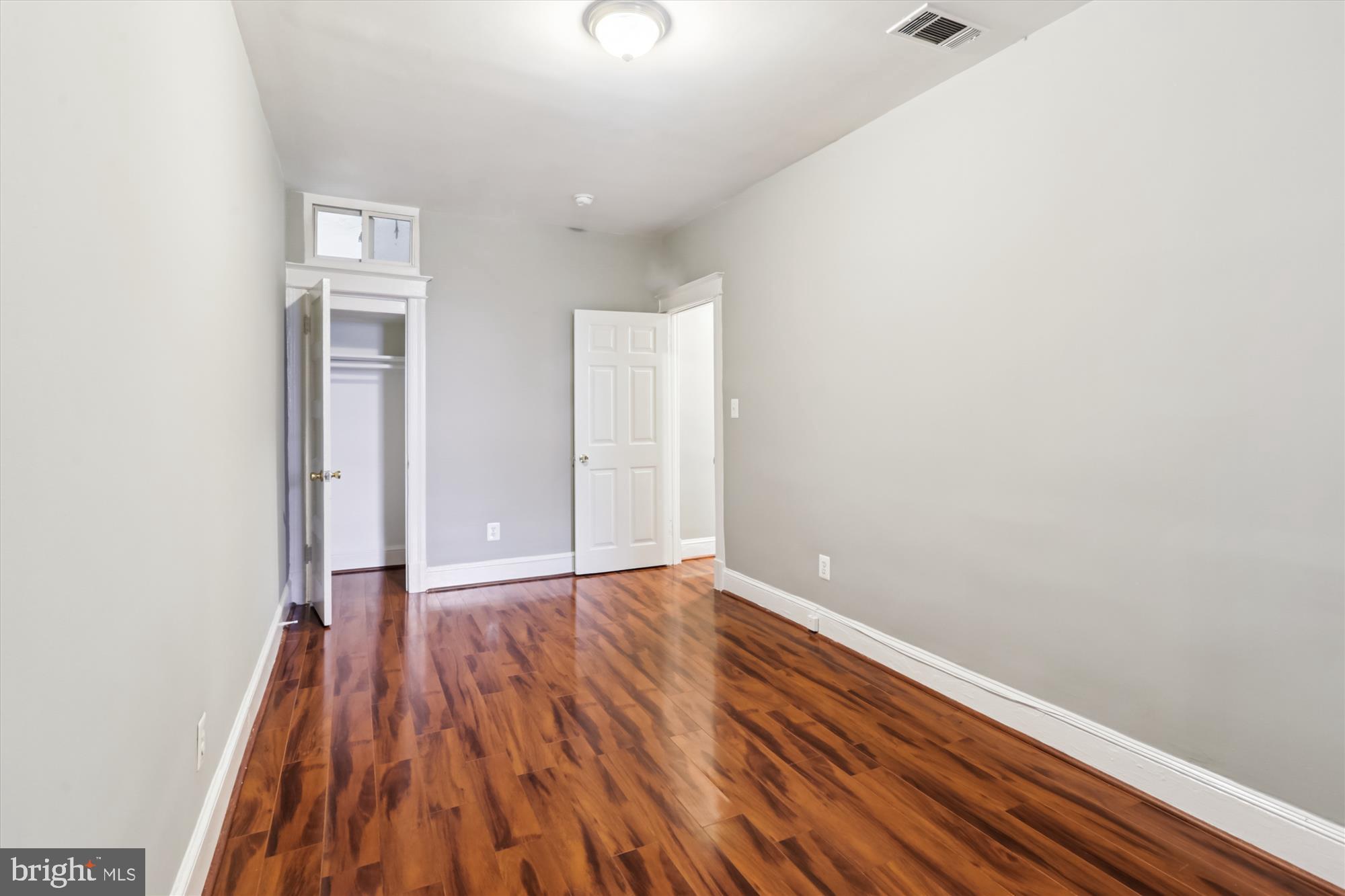 1712 West Virginia Avenue Northeast, Unit 1 Washington, DC 20002 - Photo 7 of 15 a view of an empty room with wooden floor