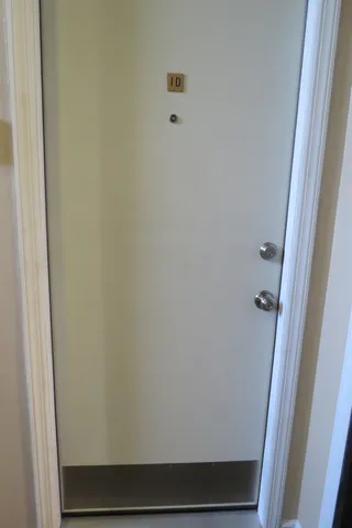 a utility room with wooden floor washer and dryer