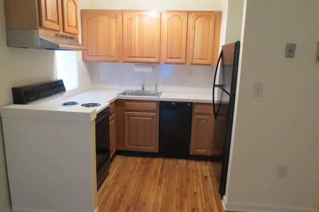 a view of room with window and wooden floor