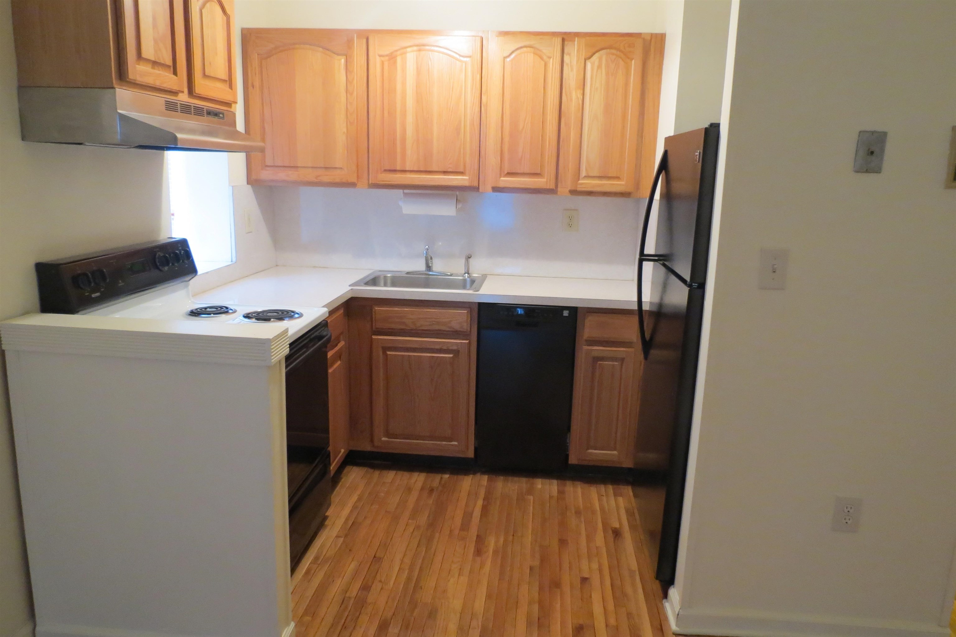 533 Monroe Street, Unit 1D Hoboken, NJ 07030 - Photo 4 of 13 a utility room with wooden floor washer and dryer