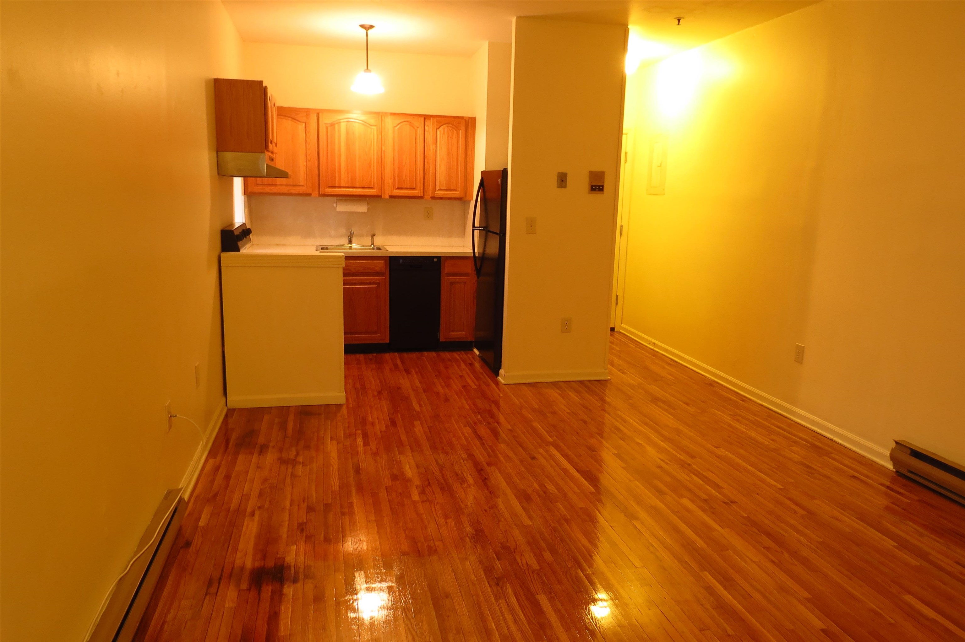 533 Monroe Street, Unit 1D Hoboken, NJ 07030 - Photo 9 of 13 a view of a kitchen with wooden floor