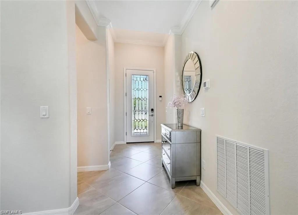 2385 Orchard Street Naples, FL 34120 - Photo 11 of 41 Tiled entrance foyer with crown molding