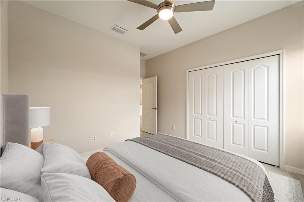 2385 Orchard Street Naples, FL 34120 - Photo 16 of 41 Bedroom 2 featuring a closet and ceiling fan