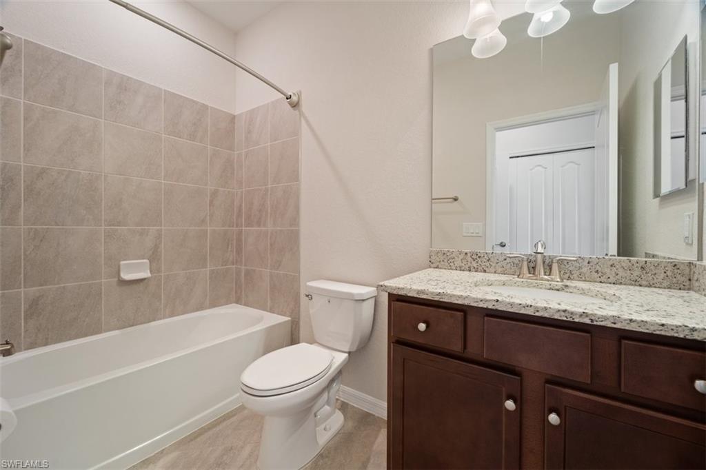 2385 Orchard Street Naples, FL 34120 - Photo 21 of 41 Full bathroom with shower / bathtub combination en suite bedroom 4