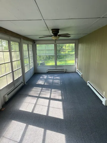 a view of balcony with wooden floor