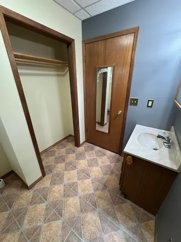 a view of closet area with empty racks