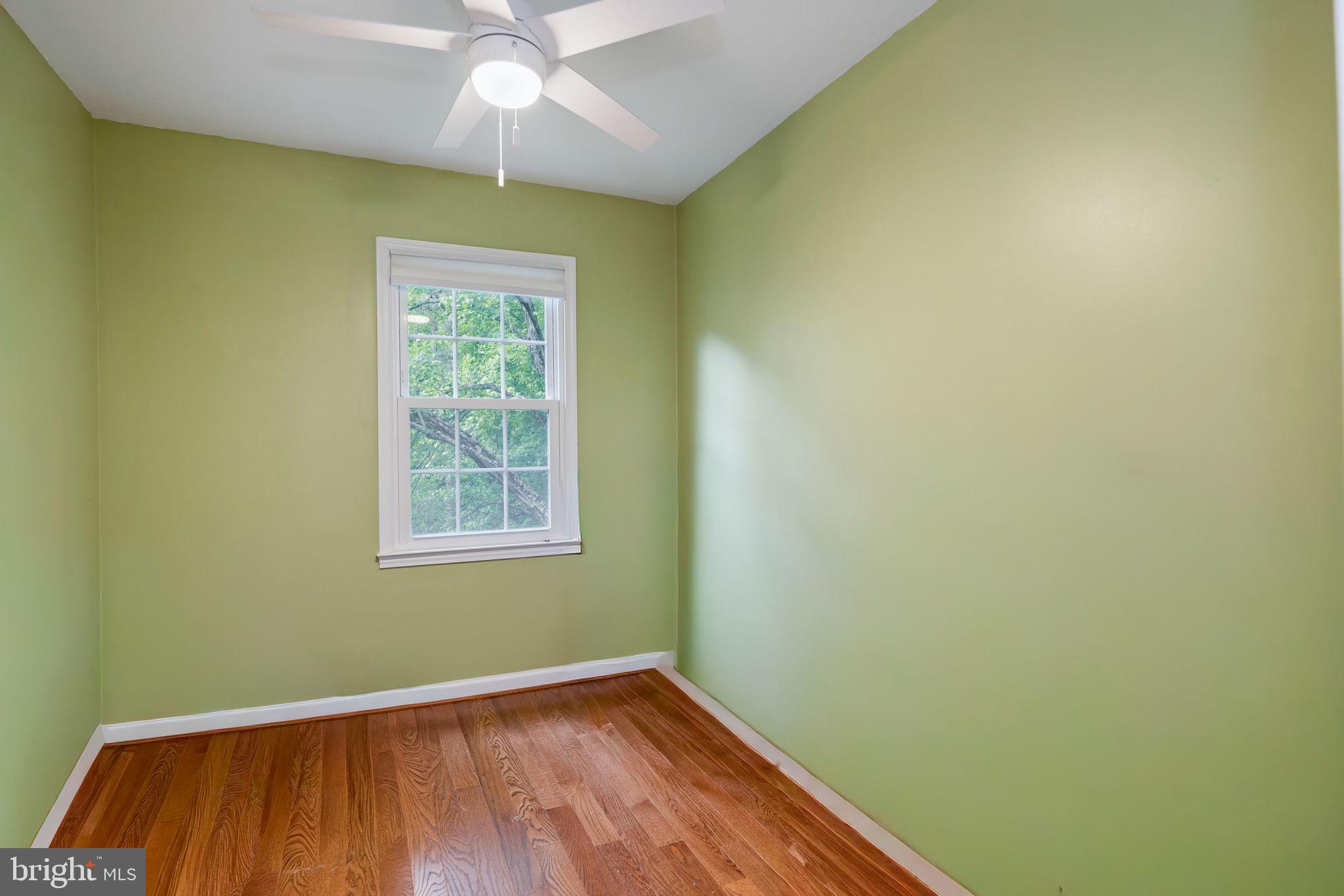 7603 Modisto Lane Springfield, VA 22153 - Photo 31 of 57 an empty room with a window and wooden floor