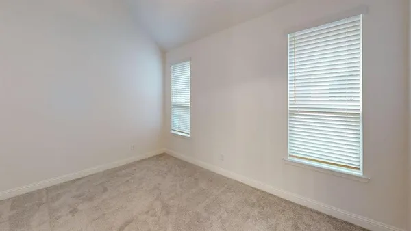 a view of hallway with wooden floor