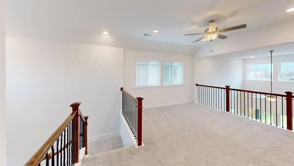a view of a hallway with windows