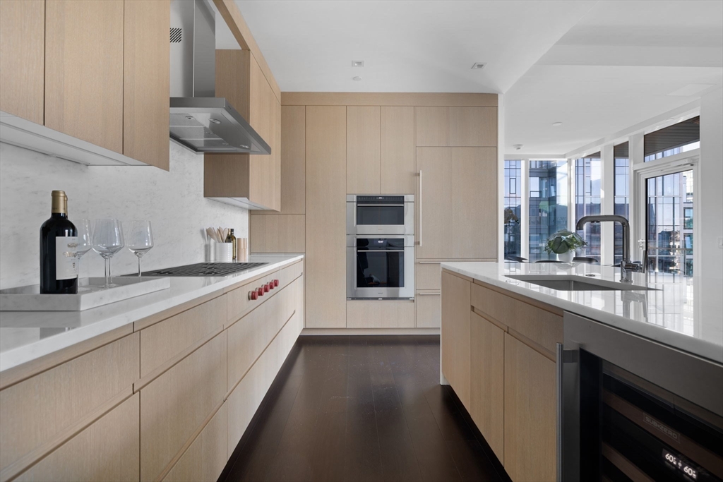150 Seaport Boulevard, Unit B Boston, MA 02210 - Photo 7 of 27 a large kitchen with a lot of counter space and a sink