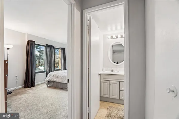 a bedroom with a bed and a mirror