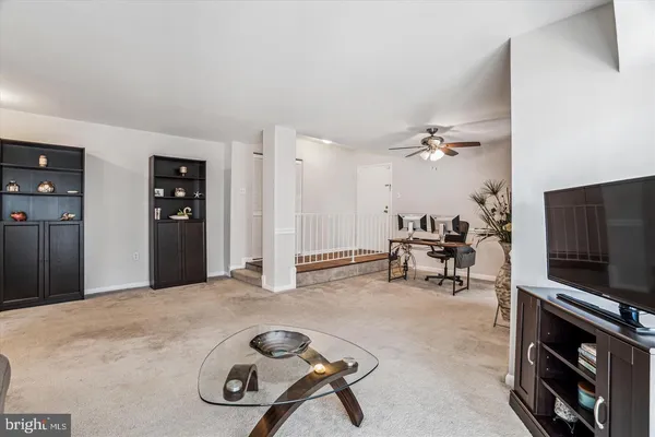 a view of a livingroom with furniture and a flat screen tv