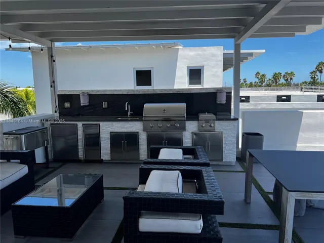 a kitchen with a refrigerator and cabinets