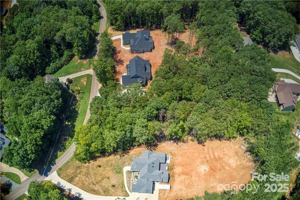 496 Kenway Loop Mooresville, NC 28117 - Photo 27 of 32 an aerial view of a house with a yard and lake view