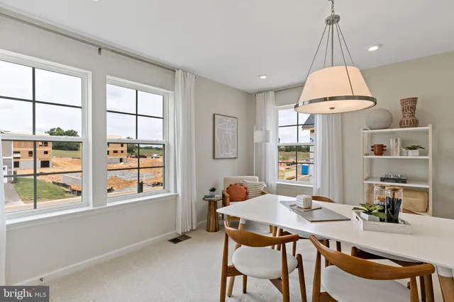a dining room with furniture and window