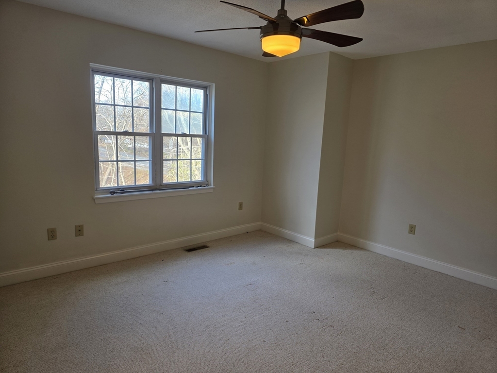 1201 Spring Valley Drive, Unit 1201 Andover, MA 01810 - Photo 9 of 18 an empty room with a window