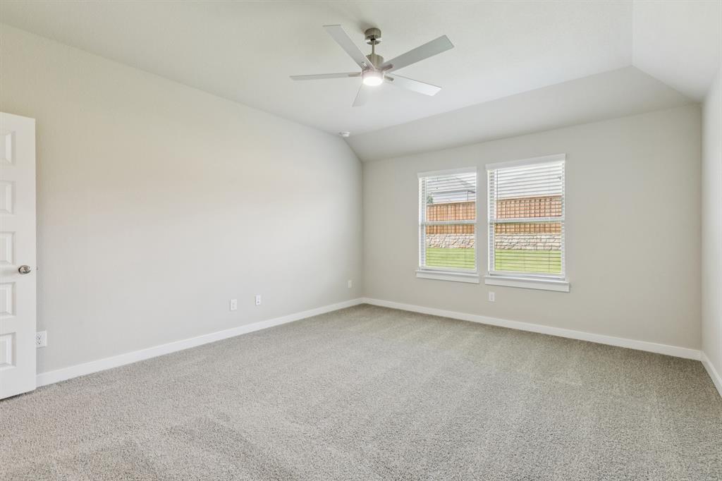 15213 Supreme Street Aledo, TX 76008 - Photo 14 of 32 an empty room with a window and a ceiling fan