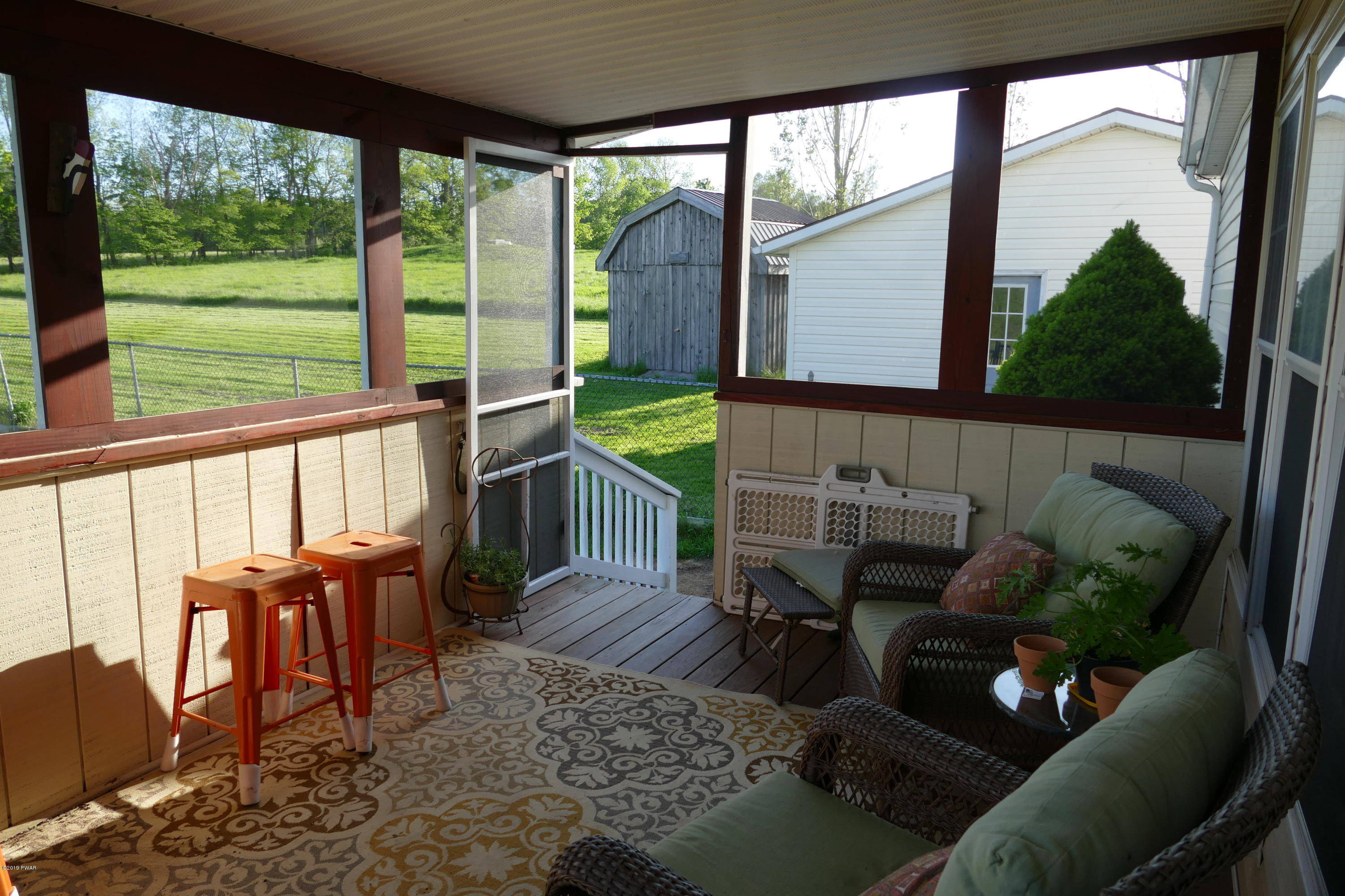 108 Savitz Road Moscow, PA 18444 - Photo 45 of 46 a balcony with furniture and a potted plant