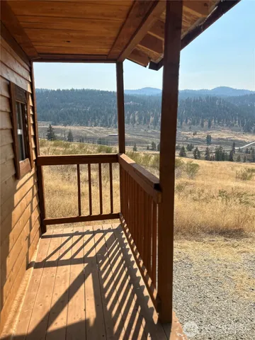 a view of a porch with wooden floor and outdoor space