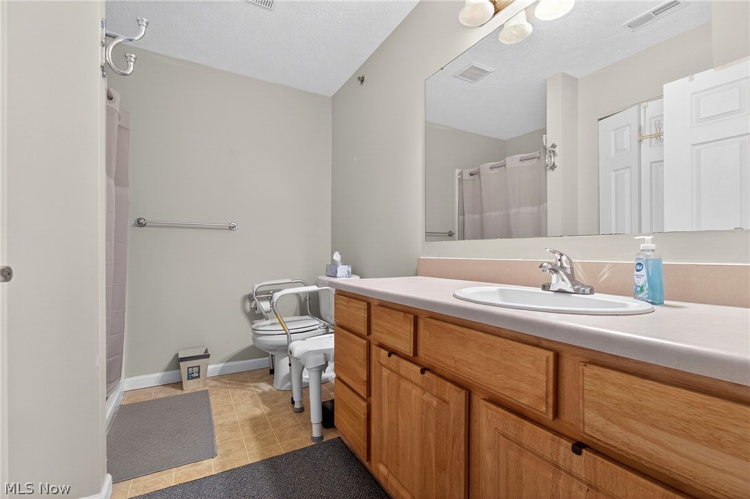 4703 Hills And Dales Road Northwest Canton, OH 44708 - Photo 14 of 25 low threshold shower with safety grip bars