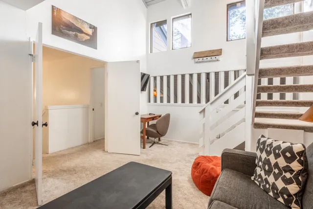 a living room with furniture and a painting