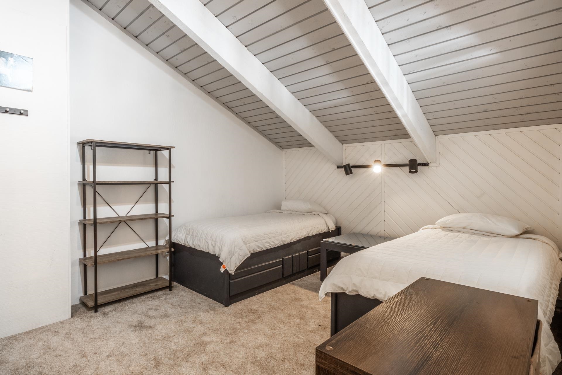 2252 Meridian Boulevard, Unit 5 Mammoth Lakes, CA 93546 - Photo 21 of 33 a bedroom with two beds and painted walls