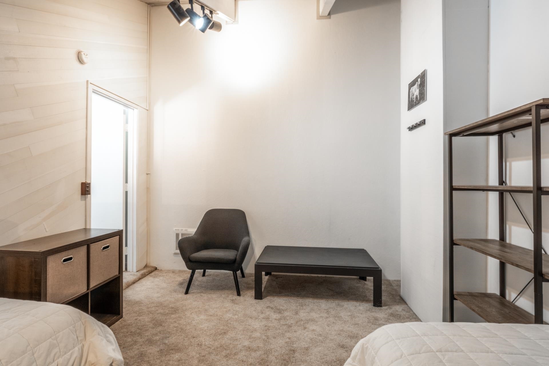 2252 Meridian Boulevard, Unit 5 Mammoth Lakes, CA 93546 - Photo 22 of 33 a bedroom with a bed and a chair