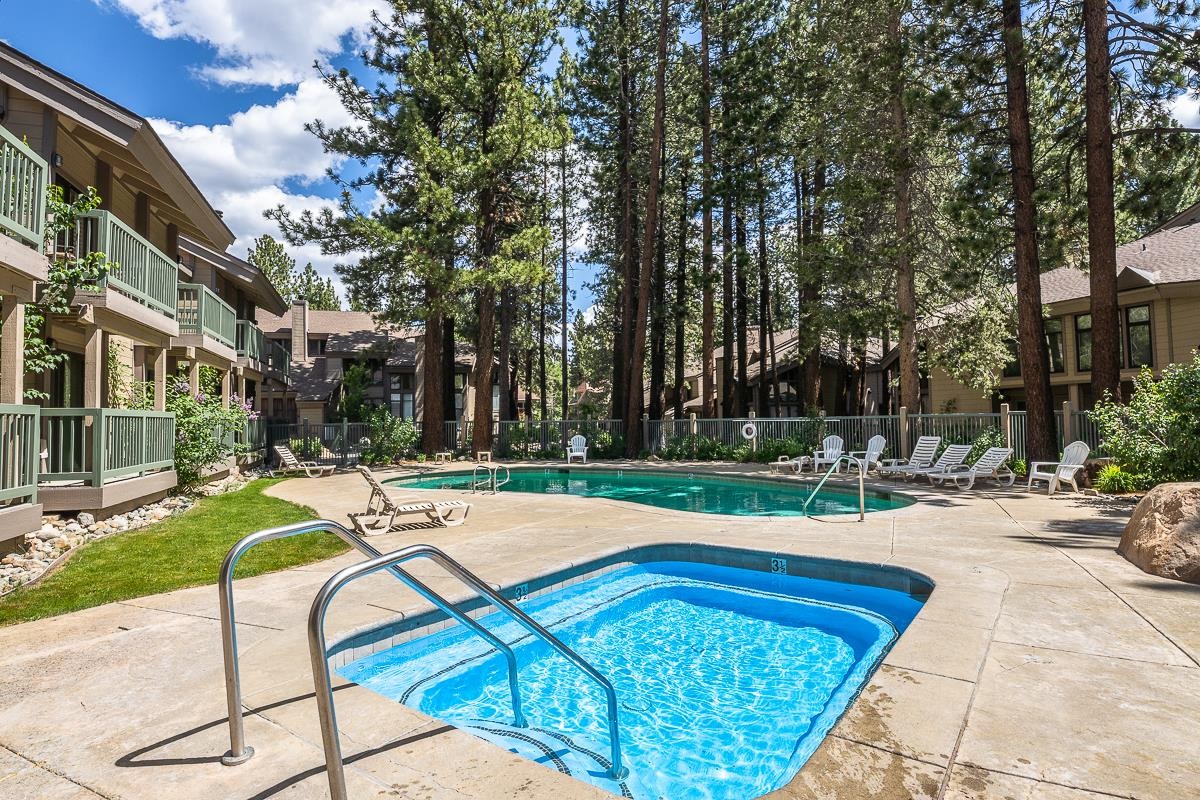 2252 Meridian Boulevard, Unit 5 Mammoth Lakes, CA 93546 - Photo 25 of 33 a view of swimming pool with lawn chairs and plants