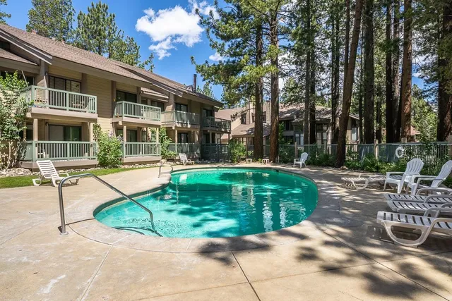 a view of a house with backyard porch and sitting area