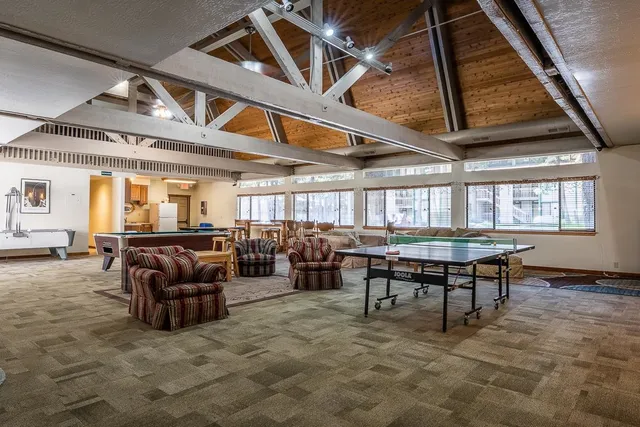 a living room with lots of furniture and a rug