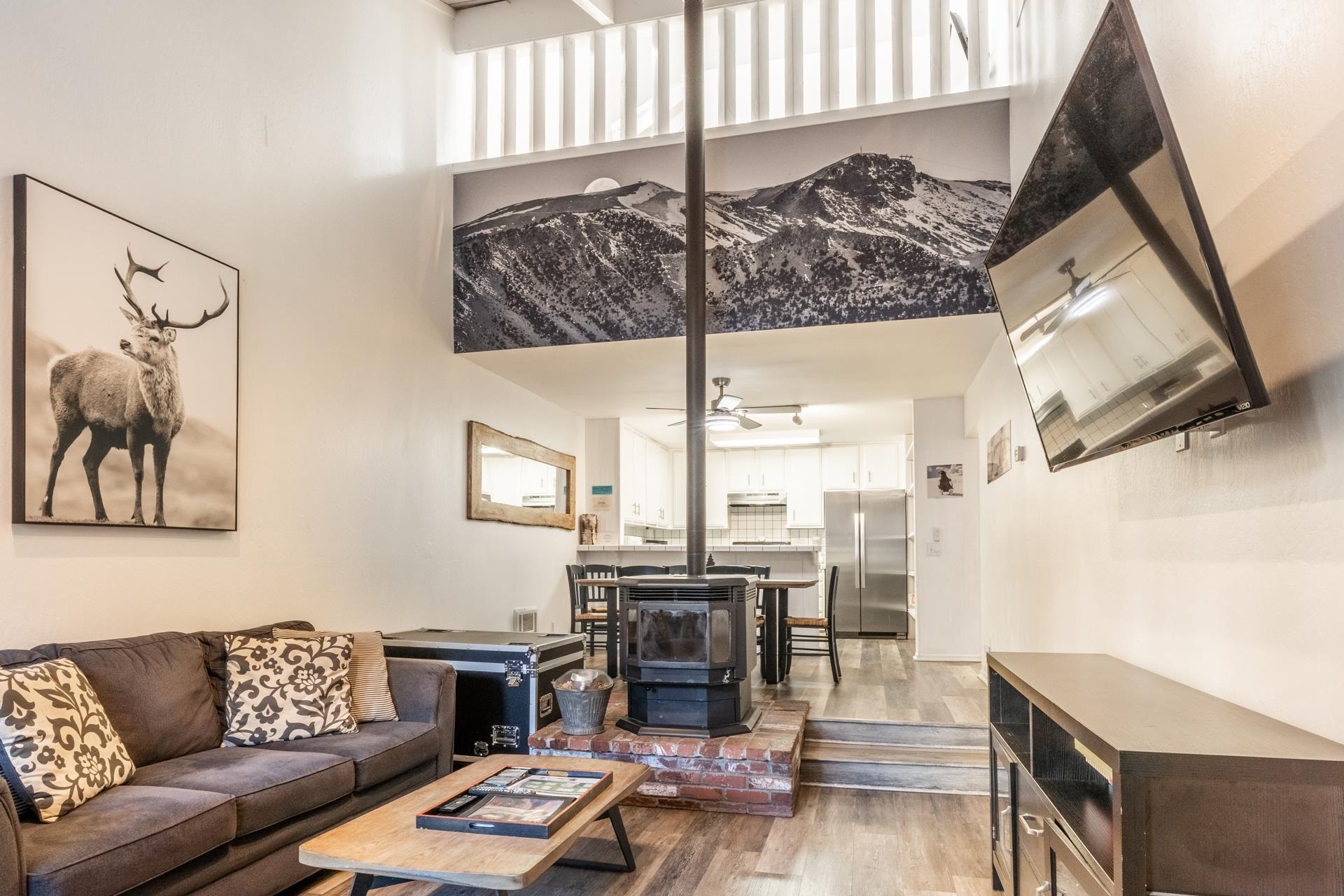 2252 Meridian Boulevard, Unit 5 Mammoth Lakes, CA 93546 - Photo 3 of 33 a living room with furniture and wooden floor