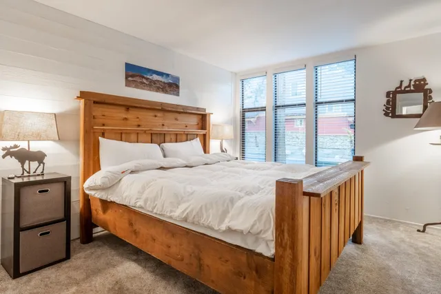 a kitchen with kitchen island a table and chairs in it