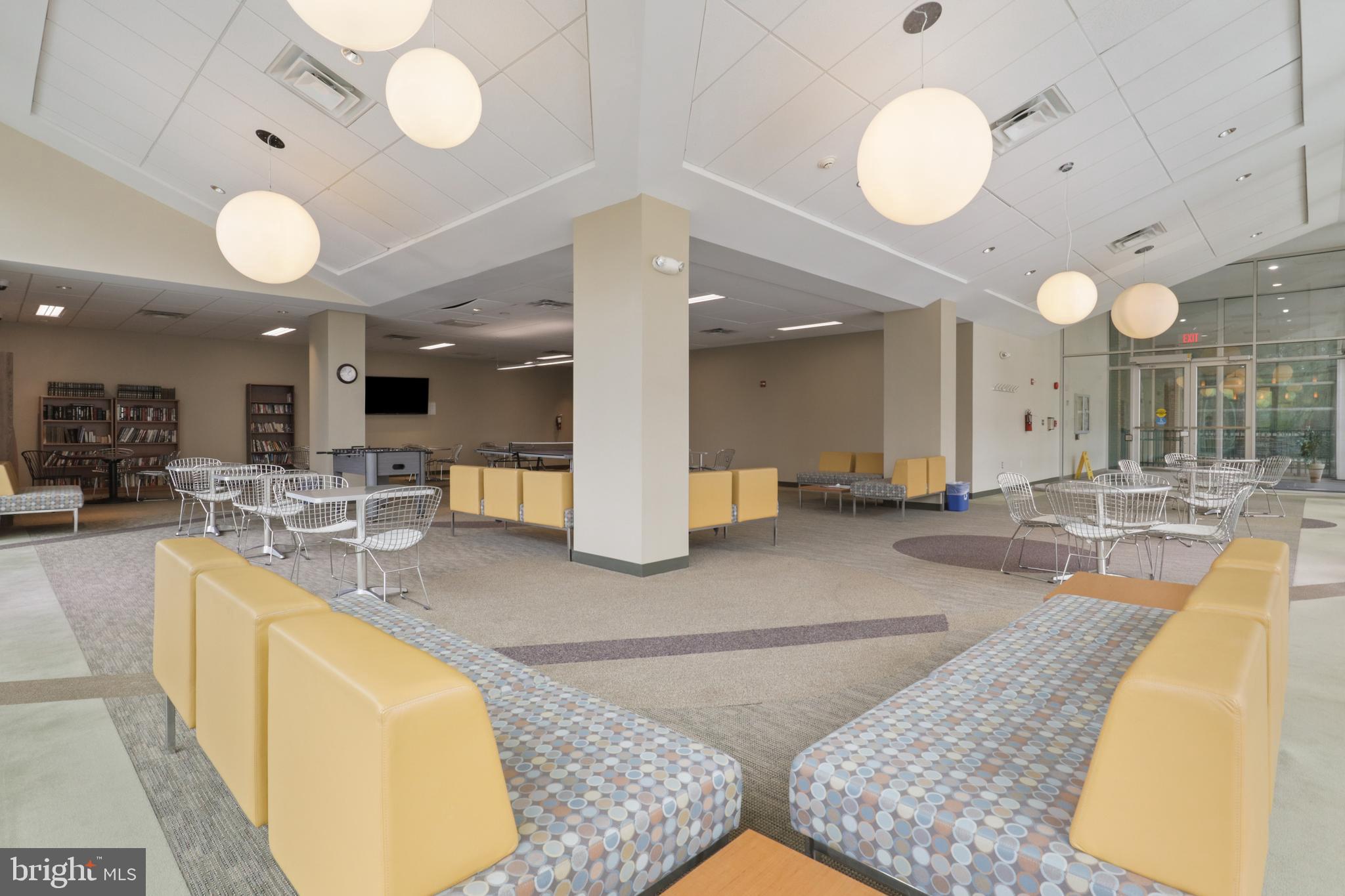 4600 South Four Mile Run Drive, Unit 207 Arlington, VA 22204 - Photo 31 of 53 an open kitchen with lots of counter space and chandelier