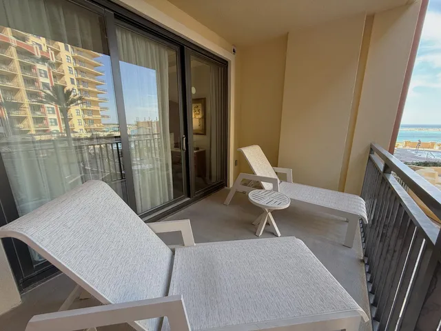 a view of a terrace with outdoor seating city view and ocean view