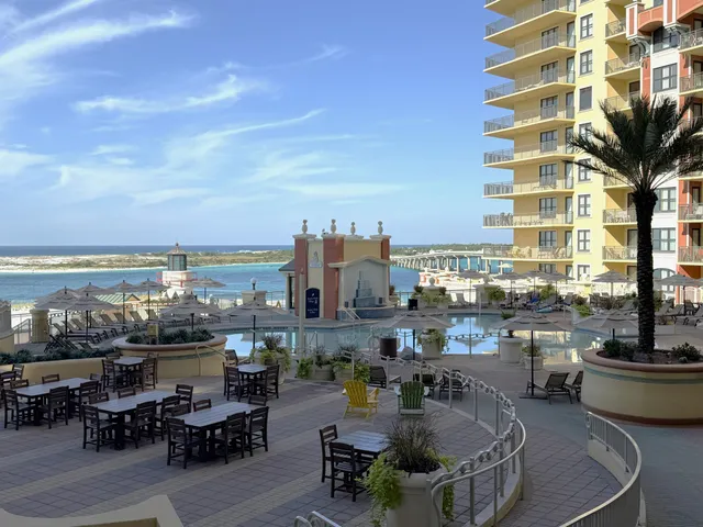 a terrace with outdoor seating and city view