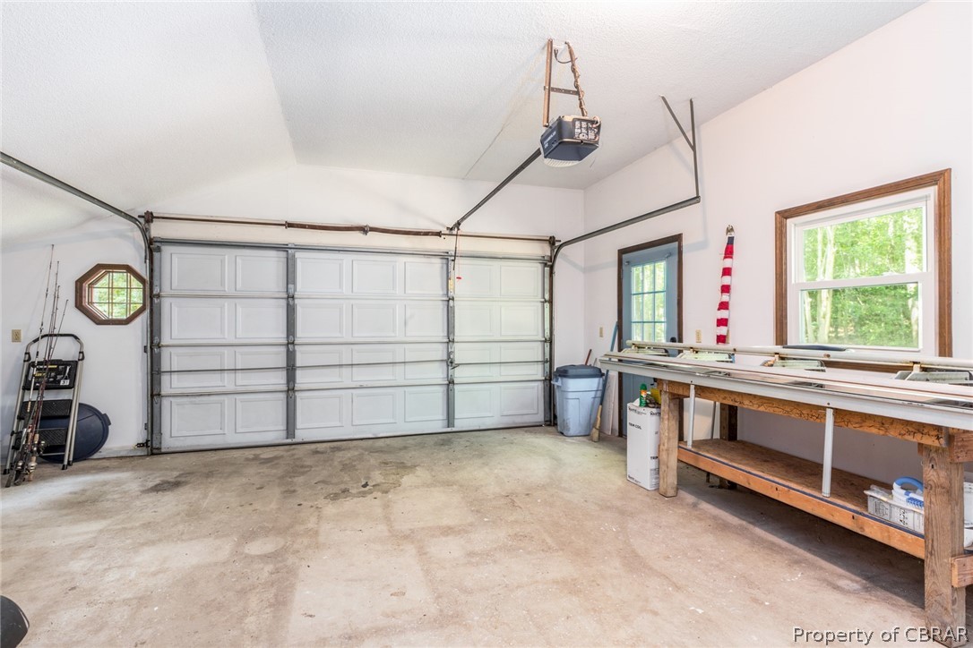 10060 Figg Shop Road Gloucester, VA 23061 - Photo 28 of 38 Attached 1.5 car garage with work bench and automatic door.