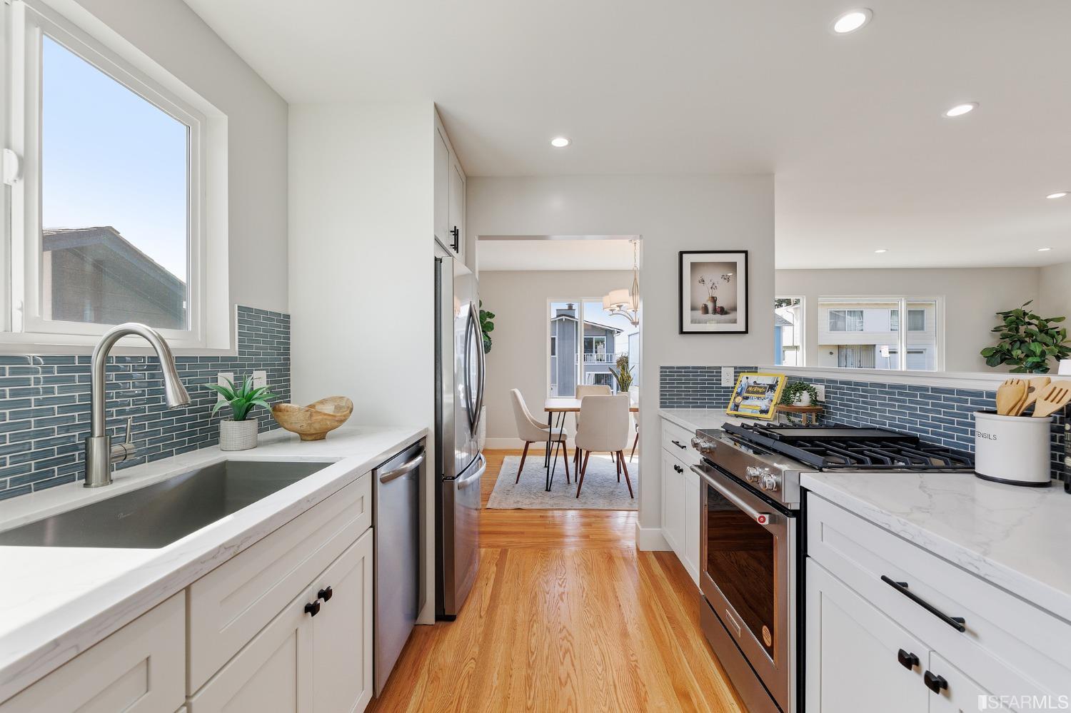 151 Longview Drive Daly City, CA 94015 - Photo 4 of 11 a kitchen with granite countertop lots of counter top space and wooden floor