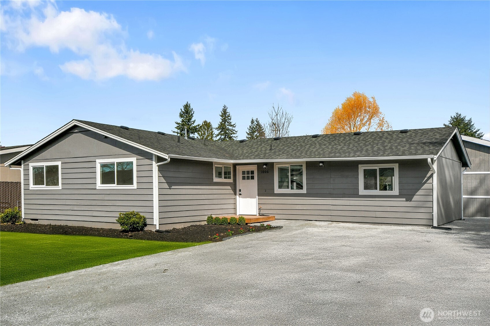 1006 Fidalgo Street Sedro-Woolley, WA 98284 - Photo 1 of 20 a front view of a house with a yard and garage