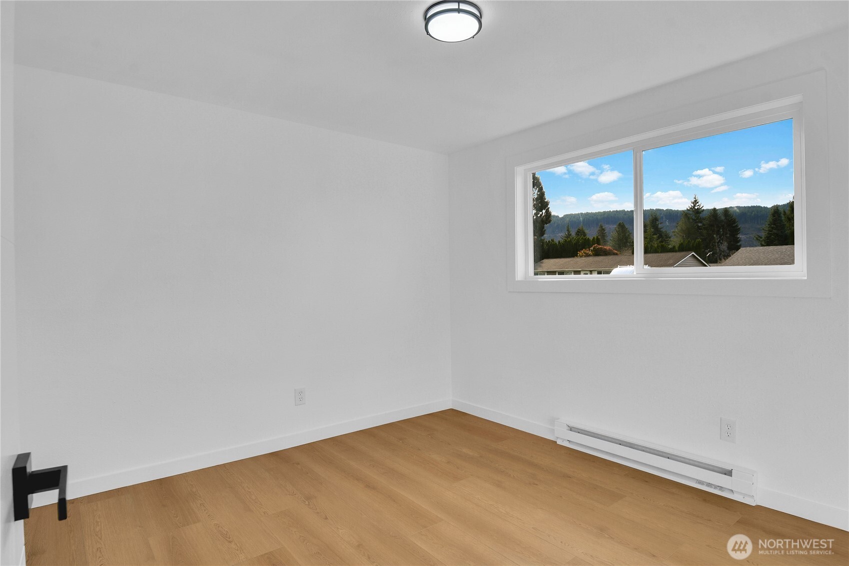 1006 Fidalgo Street Sedro-Woolley, WA 98284 - Photo 11 of 20 an empty room with a window