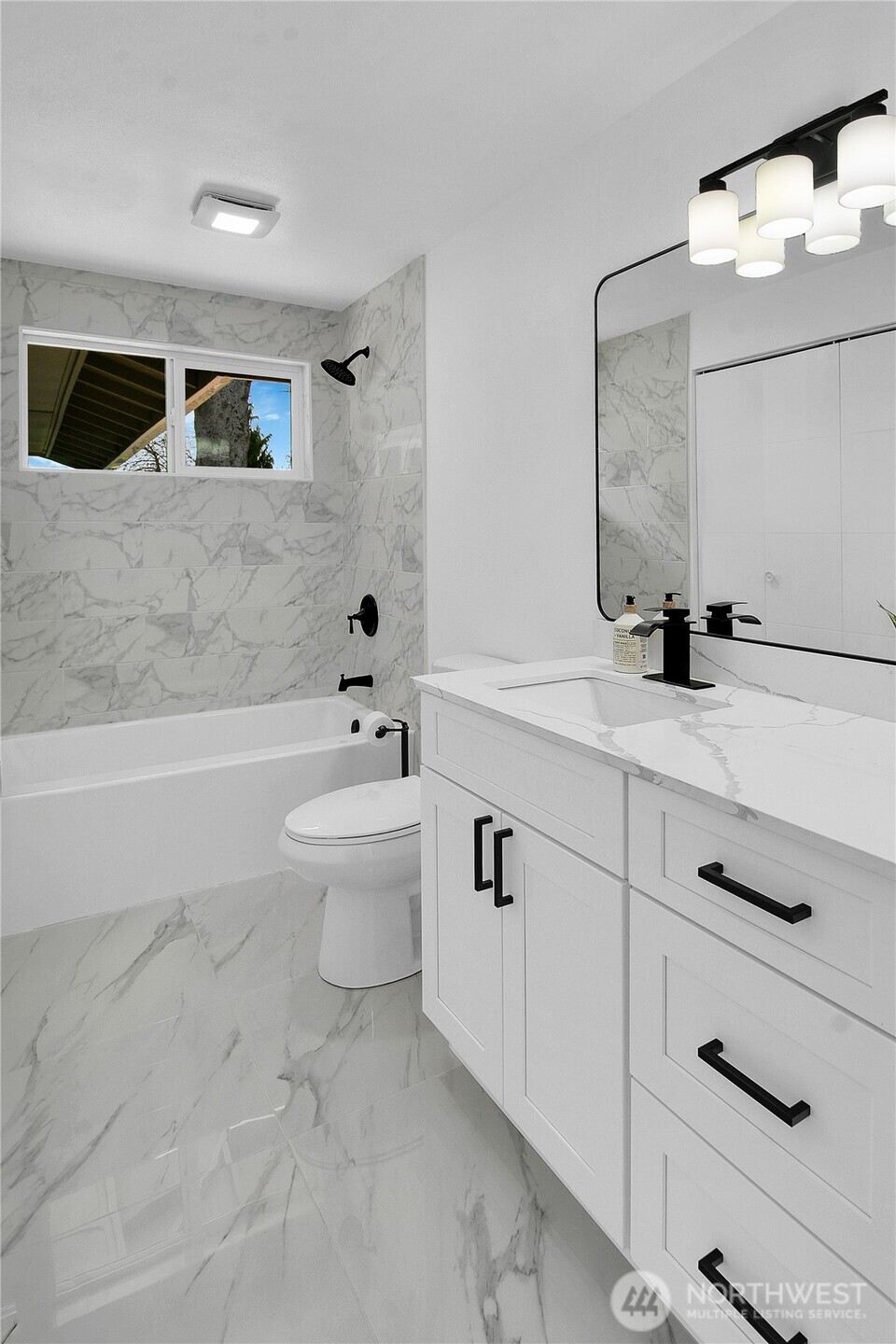 1006 Fidalgo Street Sedro-Woolley, WA 98284 - Photo 12 of 20 a bathroom with a double vanity sink toilet and mirror