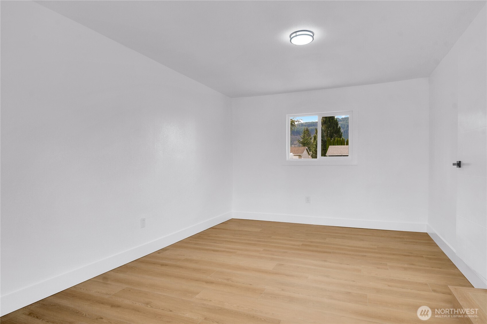1006 Fidalgo Street Sedro-Woolley, WA 98284 - Photo 16 of 20 a view of empty room with wooden floor